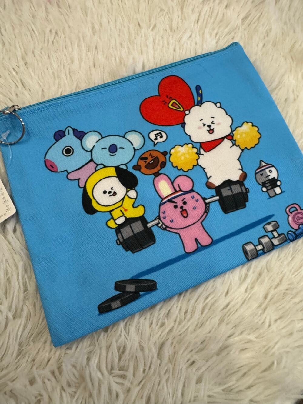 Blue BT21 pencil make up pouch with cartoon characters lifting weights
